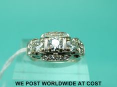 A 14ct white gold ring set with round brilliant cut diamonds (size M)
