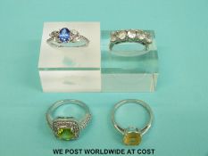 Four silver rings variously set with diamonds, peridot, amethysts, white sapphires and citrines (13.