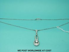 A platinum necklace set with diamonds, the largest approximately 0.