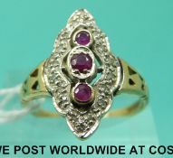 A 9ct gold ring set with three rubies surrounded by diamonds (size Q)