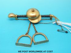 A Victorian brooch in the form of a jockey's cap,