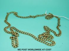 A yellow metal necklace made up of double links (23.
