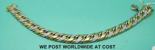 A Chopard 18ct bi-coloured gold bracelet with alternate links set with diamonds (82g)
