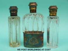 A Victorian hallmarked silver gilt and cut glass hip flask and two matching bottles,