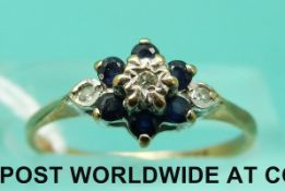 A 9ct gold ring set with diamonds and sapphires in a cluster (size L)