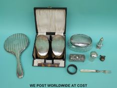 A cased pair of hallmarked silver mounted brushes, silver mounted mirror,