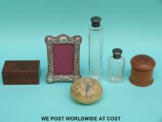 A hallmarked silver photograph frame (height approximately 12cm), hallmarked silver mounted bottles,