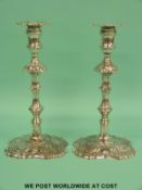 A pair of George II hallmarked silver candlesticks of cast iron construction,