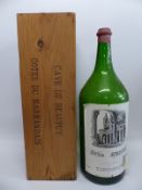 An empty Balthazar sized bottle of Cotes du Marmandais complete with wooden case