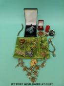 A Hattie Carnegie brooch in the form of a leopard and a pair of earrings, a Coro necklace,
