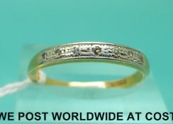 An 18ct gold ring set with diamonds in a platinum setting (size Q)