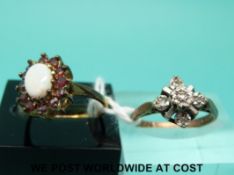 A 9ct gold ring set with diamonds (size J) and a 9ct gold ring set with an opal and garnets (size