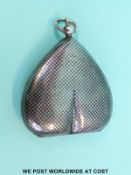 A hallmarked silver sovereign holder with chequered niello decoration to the outside and three coin