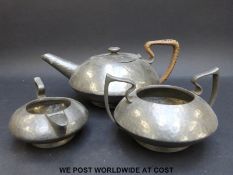 An Art Deco hammered pewter tea set marked Hatton Sheffield