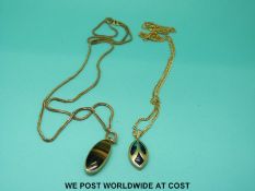 Two 9ct gold necklaces/ chains and two pendants, one marked 9ct gold and set with tiger's eye (7.