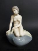 A large Royal Copenhagen figure of a mermaid (21cm high)