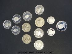 Thirteen commemorative coins including silver proof example, £5 coins etc.