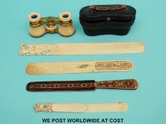 Two 19thC Chinese carved ivory page turners, an ivory paper clip,