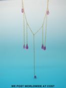 An 18ct gold necklace with seven drop rubies in briolette cut by Philippa Holland