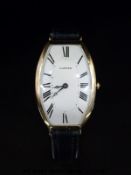 Cartier 18ct gold tonneau shaped curved wristwatch with blued Breguet hands, Roman numerals,