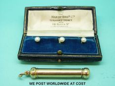 A set of three 15ct gold studs in Hardy & Co, Brisbane,