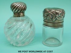 Two hallmarked silver perfume bottles one being a Victorian wrythen moulded example.