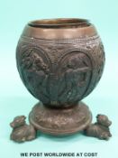 An Indian mounted carved coconut cup with plated mount and liner,