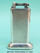 A Dunhill silver plated table lighter with engine turned decoration,