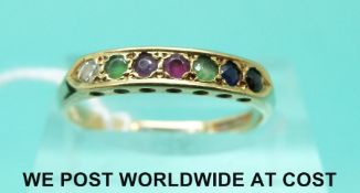 An 18ct gold ring set with a diamond, emerald, sapphire, ruby,