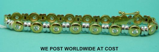 An 18ct bi coloured gold bracelet set with round cut diamonds (21.