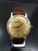 Smith Imperial gentleman's wristwatch with gold hands and Arabic numerals, on brown leather strap,