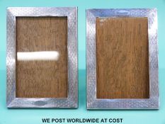 A pair of George V hallmarked silver engine turned photograph frames,