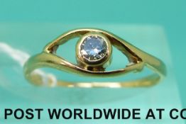 A yellow metal ring set with a diamond (size K)