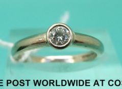 An 18ct white gold ring set with a diamond of approximately 0.