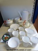 A Royal Worcester coffee service and a Wedgwood teapot, milk, sugar etc.