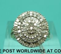 A 9ct white gold ring set with round and baguette cut diamonds in a cluster (size J)