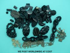 A quantity of white metal/ silver chains, a filigree brooch, silver charm bracelet,