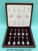A cased set of hallmarked silver spoons with feature hallmarks and heraldic finials 