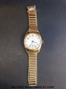 Pierce 9ct gold gentleman's wristwatch with subsidiary seconds dial and Arabic numerals,