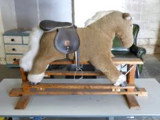 A Mamas & Papas soft toy style rocking horse, length 118cm.