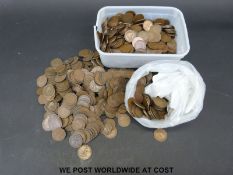 A large quantity of UK pennies, approximately 15.