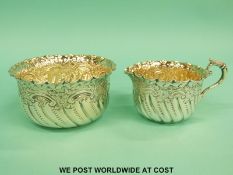 A Victorian hallmarked silver embossed sugar bowl and milk jug, Sheffield 1893, maker Lee & Wigfull,