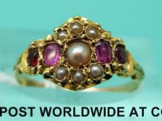 A yellow metal Victorian ring set with rubies and seed pearls (size N)