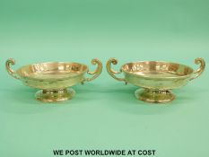 A pair of George V hallmarked silver twin handled bon bon dishes,