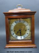 A Comitti London three train mantel clock in 'bell top' style case