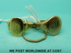 A 9ct gold band, a 9ct gold signet ring and a yellow metal signet ring (8.