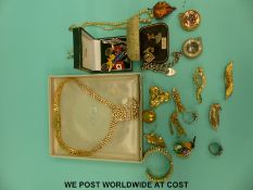 A collection of costume jewellery to include silver rings, silver curb link bracelet,