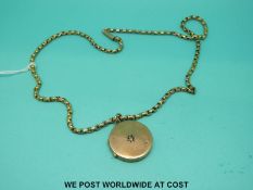 A Victorian yellow metal locket set with a diamond on a 9ct gold chain (13.