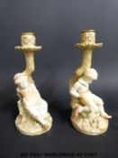 A pair Royal Worcester figural candlesticks with puce mark (22.