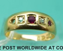 An 18ct Victorian gold ring set with diamonds and rubies (size M)